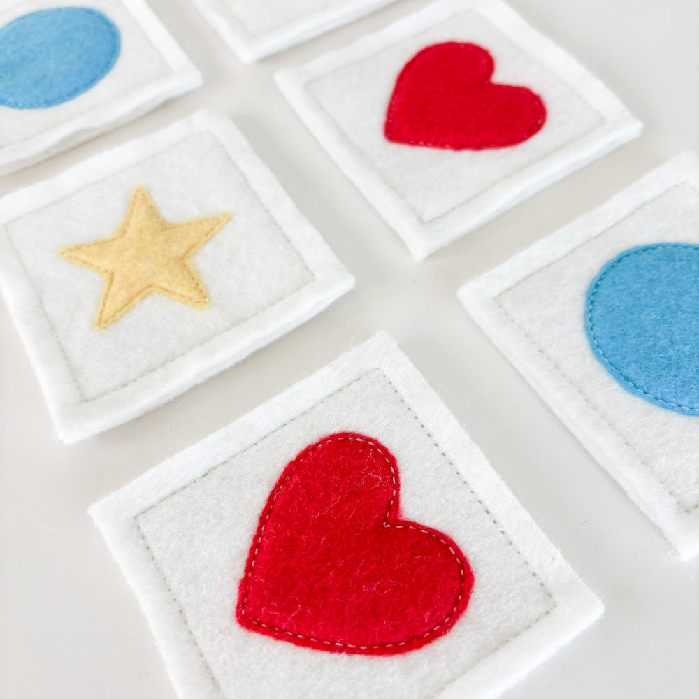 Colorful star and heart shapes on white square backgrounds
