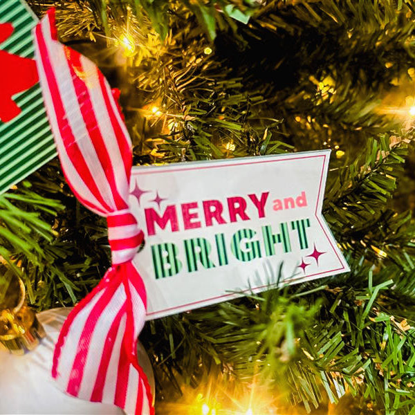 Decorative Christmas tag with 'Merry and Bright' text on a Christmas tree.