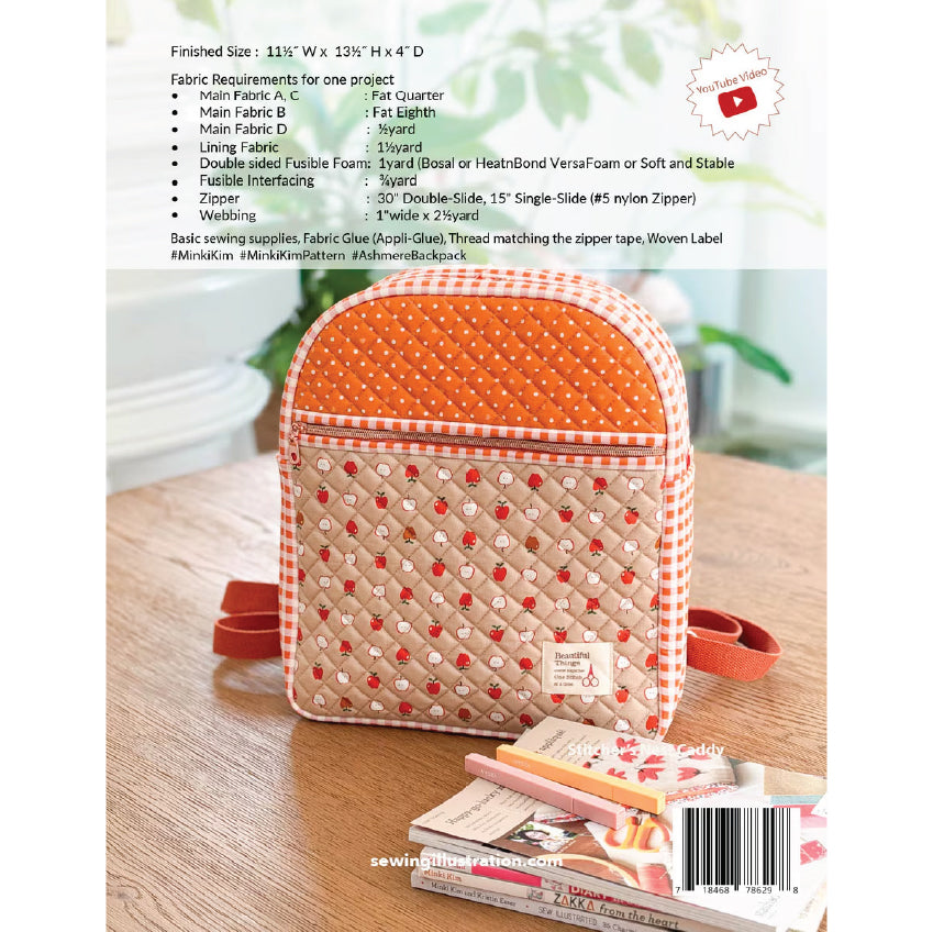 A fabric sewing pattern cover for a quilted fabric case, showing the finished size, fabric requirements, and a photo of the completed quilted case on a wooden surface. The case has a peach and white polka-dot top, a white and red gingham side, and a quilted red-and-white floral pattern.