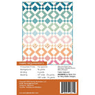 Back cover of a sewing pattern package showing a quilt fabric design with a multicolor geometric pattern, along with fabric requirements and a barcode.