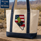 Tote bag with Nevada design in a desert setting with 'Welcome to Nevada' sign.