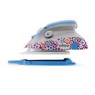 Hair straightener with colorful patterned cover on a white background