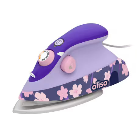 A purple and lavender Oliso steam iron with a pink and navy floral pattern on the base, shown on a solid white background.