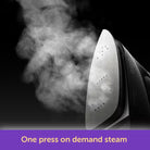 Steam iron with steam rising against a dark background, featuring the brand 'Dreco'.
