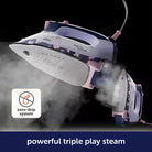 Steam iron with floral design on a black background, featuring a 'zero-drip system' icon.