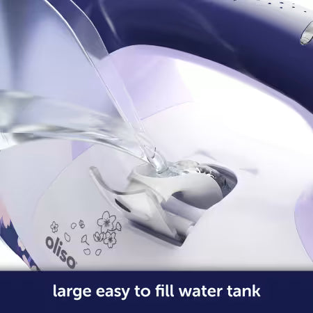 Oliso iron with water being poured into the water tank
