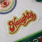 Collection of embroidered patches with text and graphics on a white background