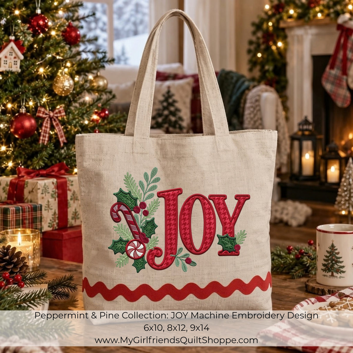 A beige canvas tote bag with a Christmas-themed machine embroidery design featuring the word 'JOY' in red, green holly, candy canes, and a red wavy stripe at the bottom. The bag is set in a cozy, festive living room decorated with a Christmas tree, wrapped gifts, and a fireplace.