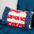 Decorative pillow with floral pattern on a blue couch