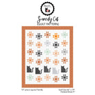 A quilt pattern cover for 'Scaredy Cat' by Penfield Quilt Company, showing a white quilt with orange, gray, and black starburst and cat motifs, framed by an orange border on a white background.