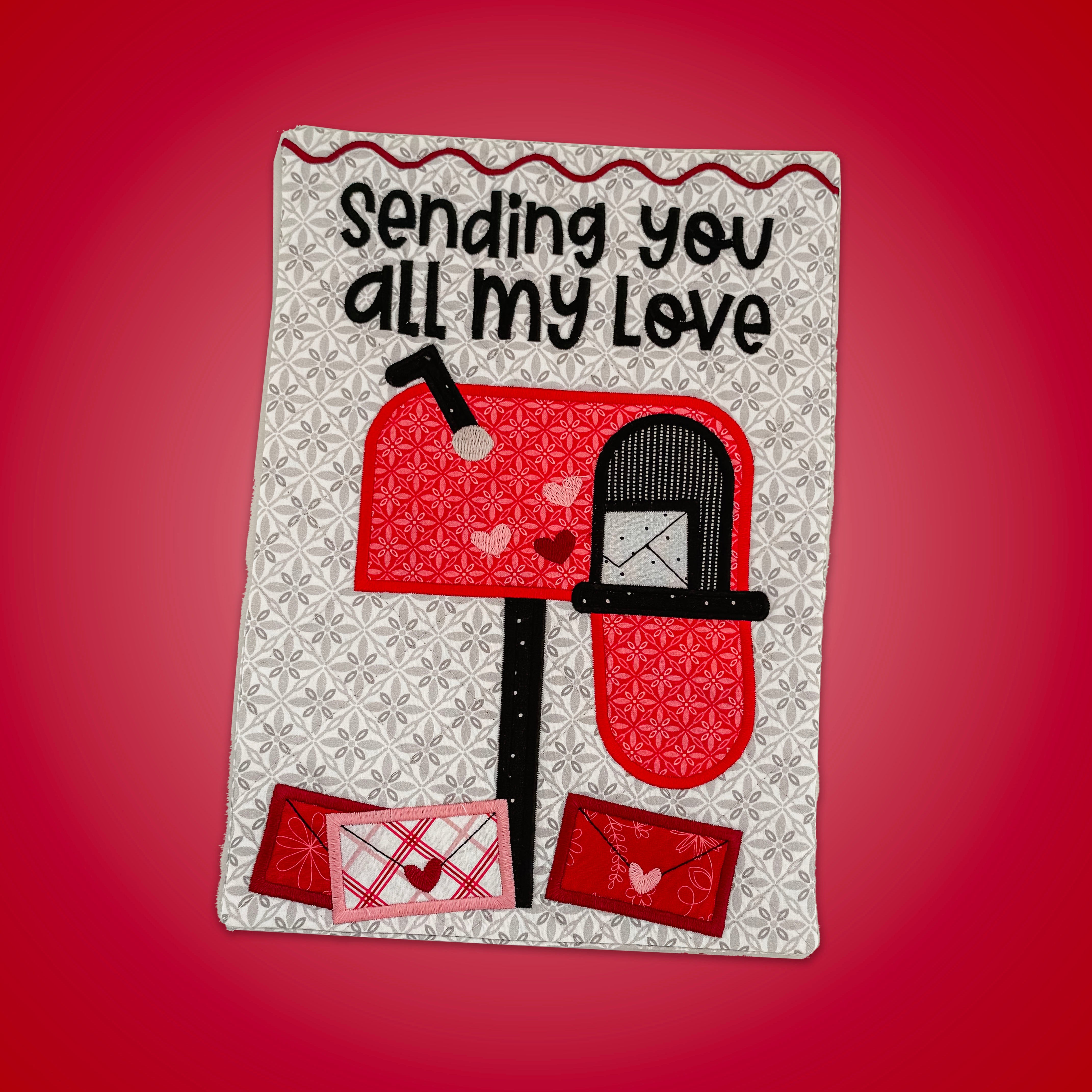 Decorative patch with two red mailboxes and text 'Sending you all my love' on a red background.