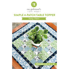 Simple 4-Patch Table Topper sewing pattern with a plant on a table