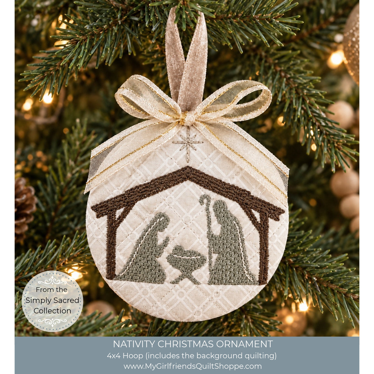 A round embroidered Christmas ornament hanging on a decorated Christmas tree. The ornament features a nativity scene with Mary, Joseph, and baby Jesus inside a stable design, tied with a beige and gold ribbon.