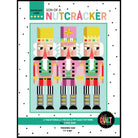 Cover of 'Son of a Nutcracker' quilt pattern with colorful nutcracker design on a light blue background.