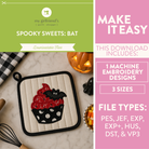 Halloween-themed product with cupcake design featuring a bat on a marble surface.