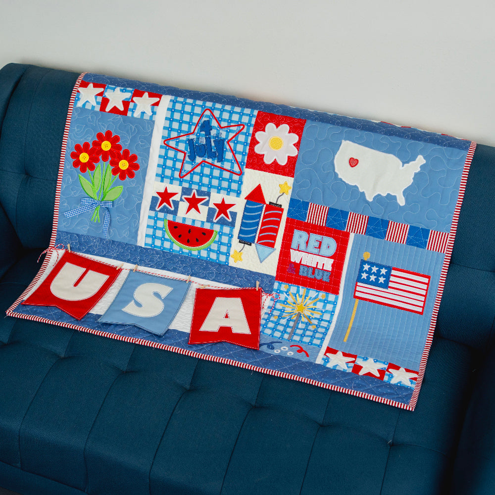 Children's quilt with patriotic designs on a blue couch