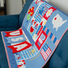 Colorful quilt with patriotic designs on a blue chair