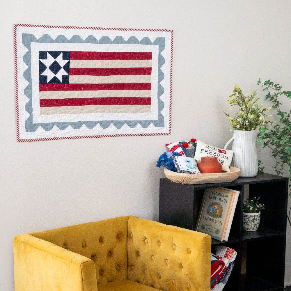 Yellow armchair in a room with a bookshelf and decorative items.