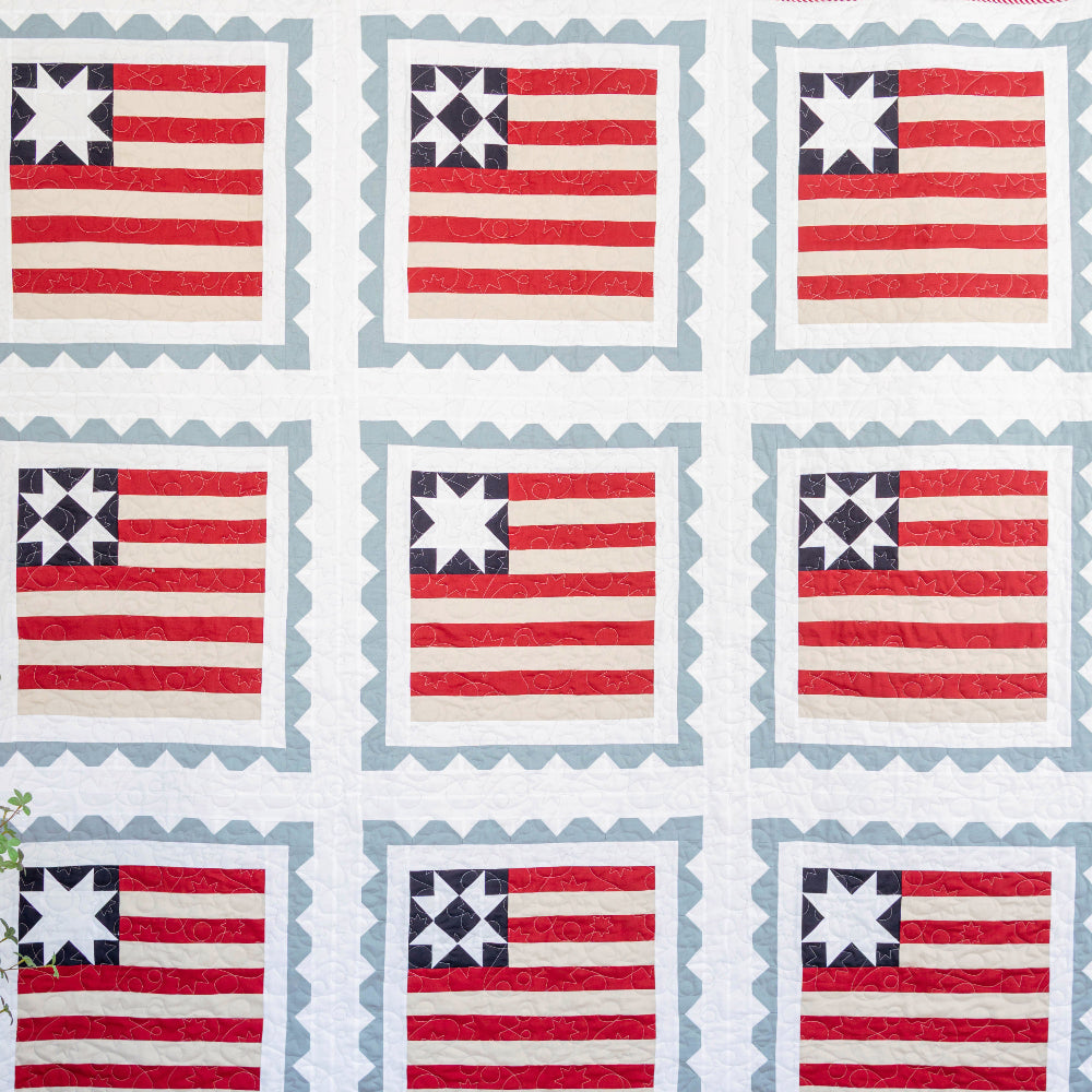 Quilt with American flag pattern on a white background