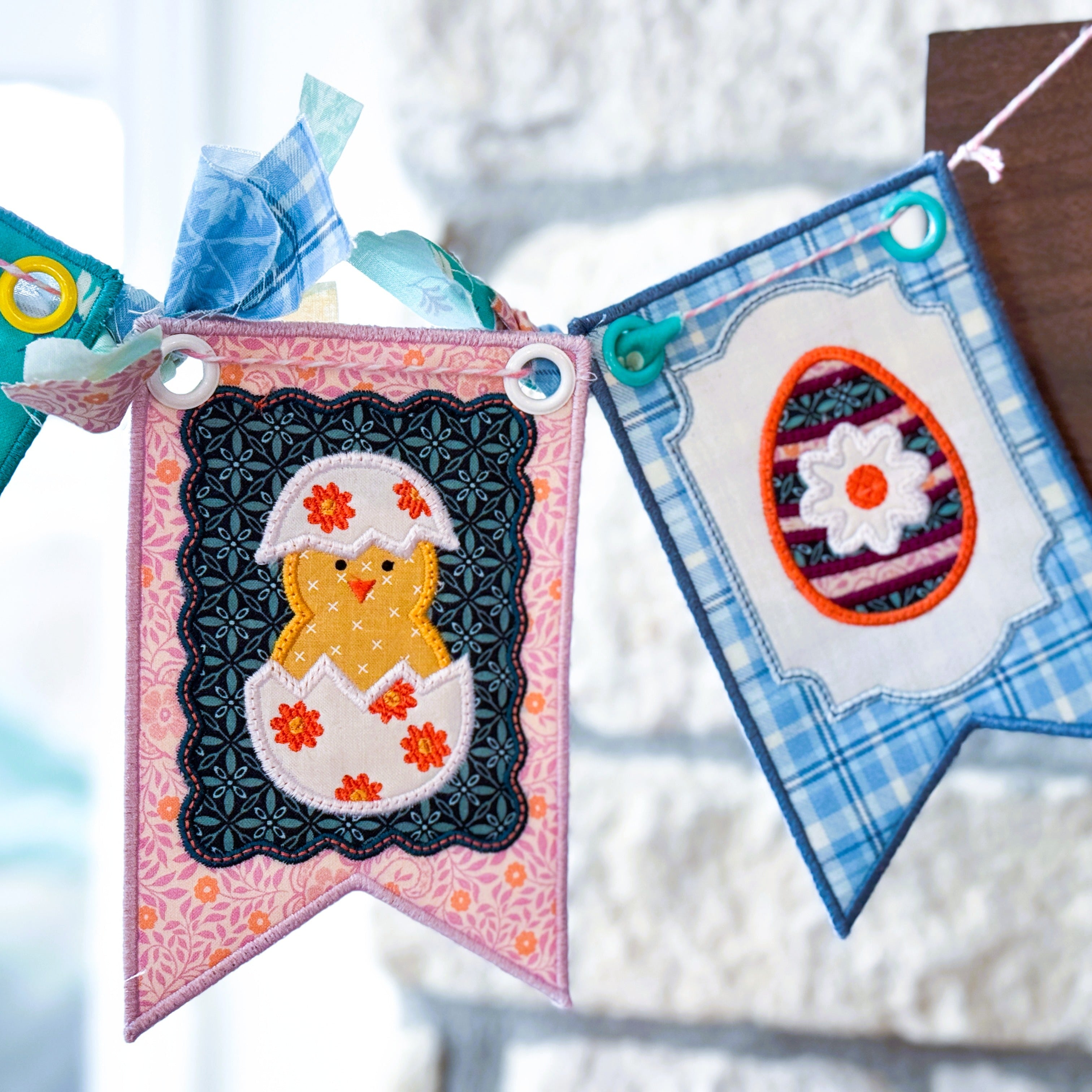 Decorative Easter banner with a chick and egg design on a wooden surface.