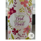 Floral-patterned product with 'Trust the Lord with all your heart' text on a white background