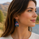 Woman wearing earrings with a scenic background