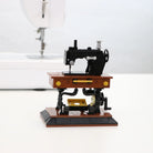 LEGO model of a vintage sewing machine on a white background