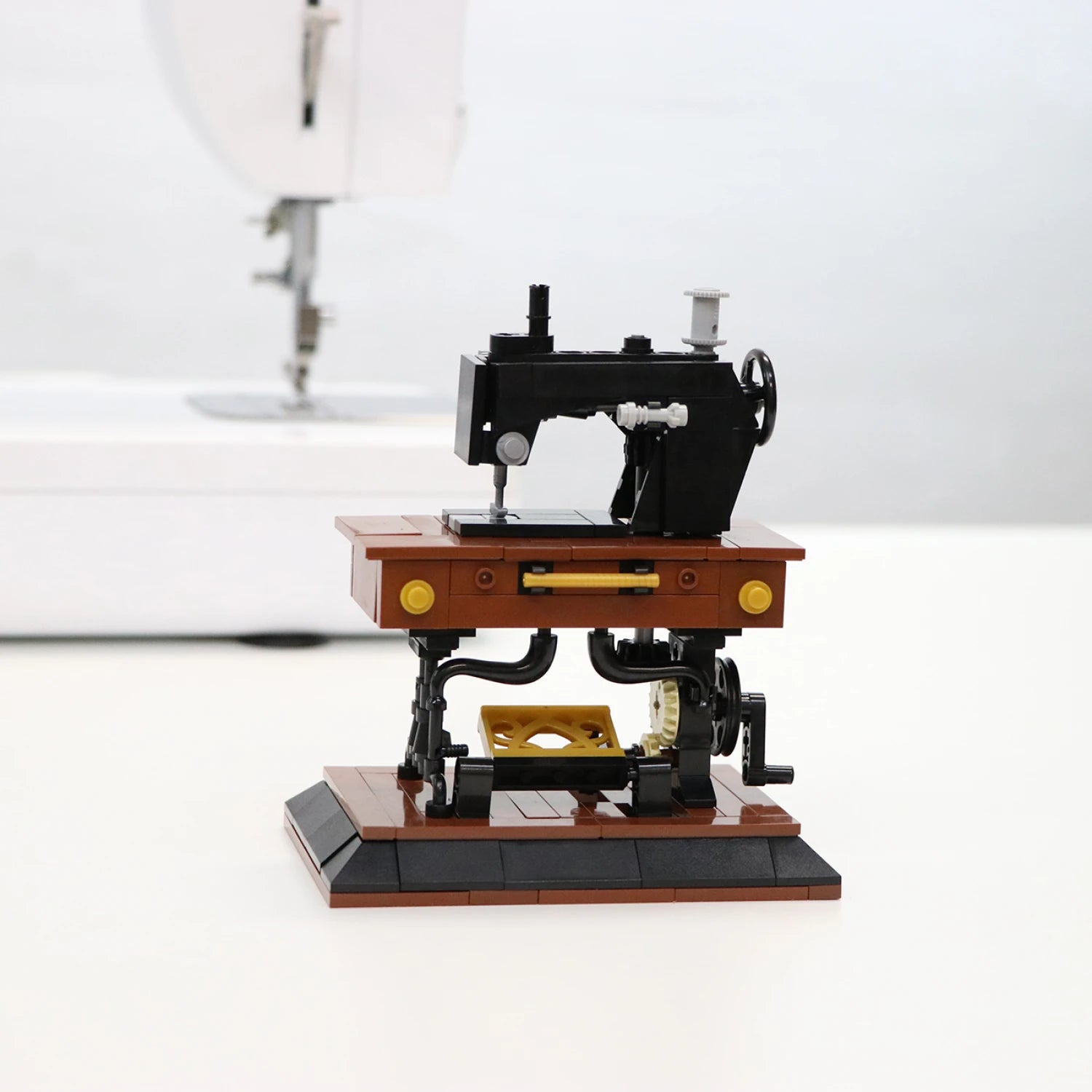 LEGO model of a vintage sewing machine on a white background