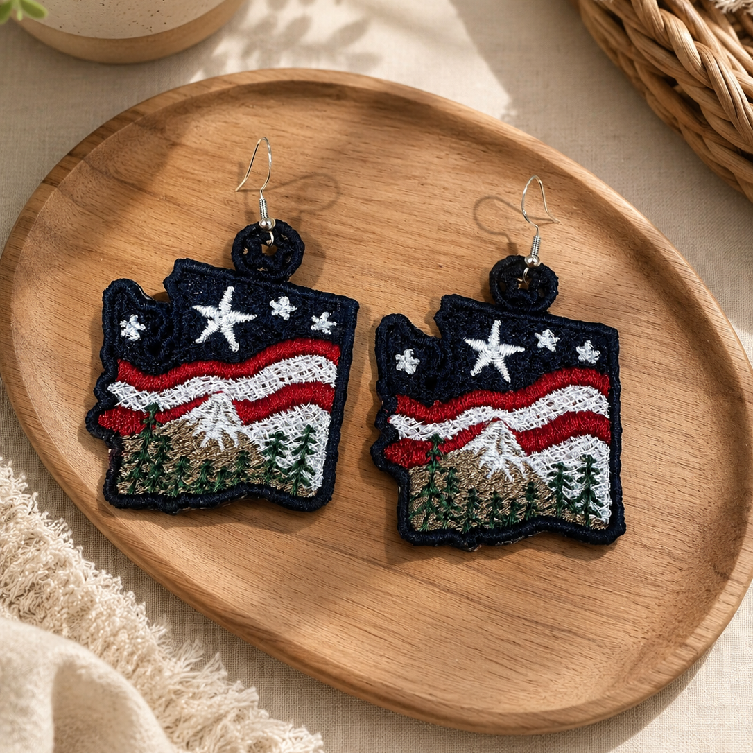 Pair of earrings with a design resembling a flag on a wooden plate.