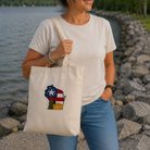 Woman holding a tote bag with a design by a lake