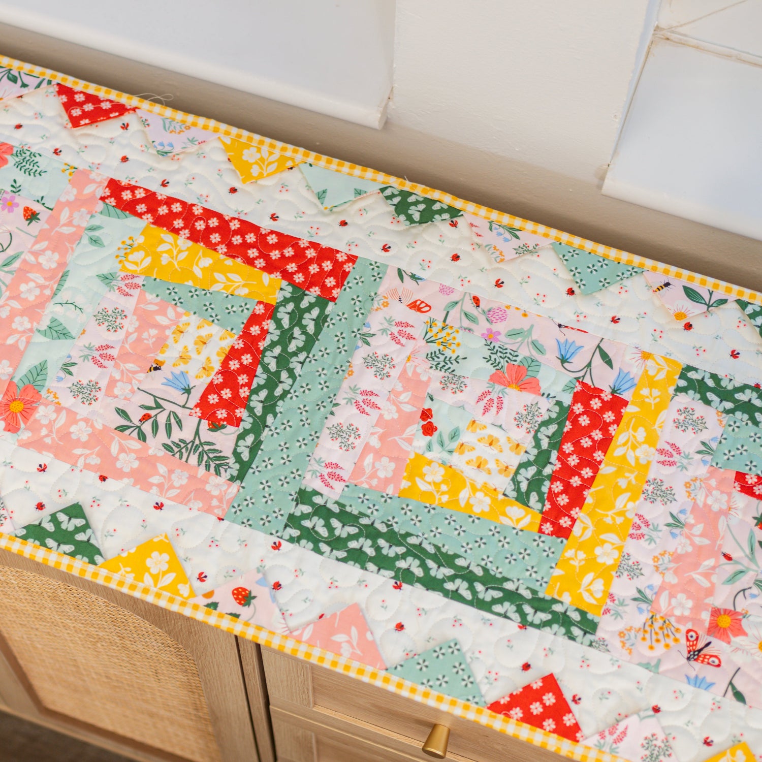 Colorful patchwork table runner on a kitchen counter