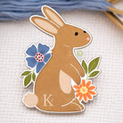 Cartoon rabbit with flowers on a textured surface