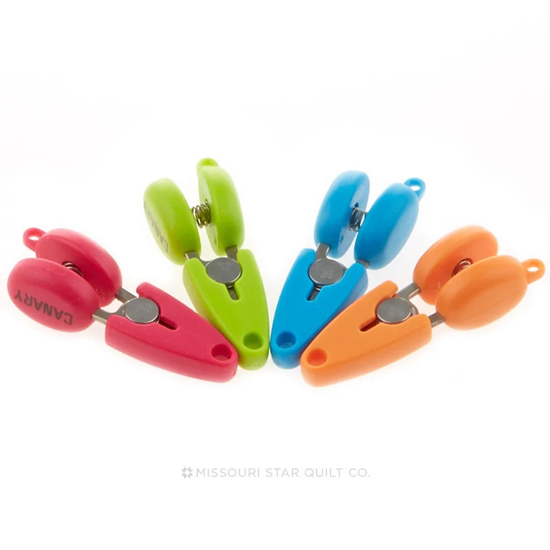 Set of colorful fabric clips on a white background