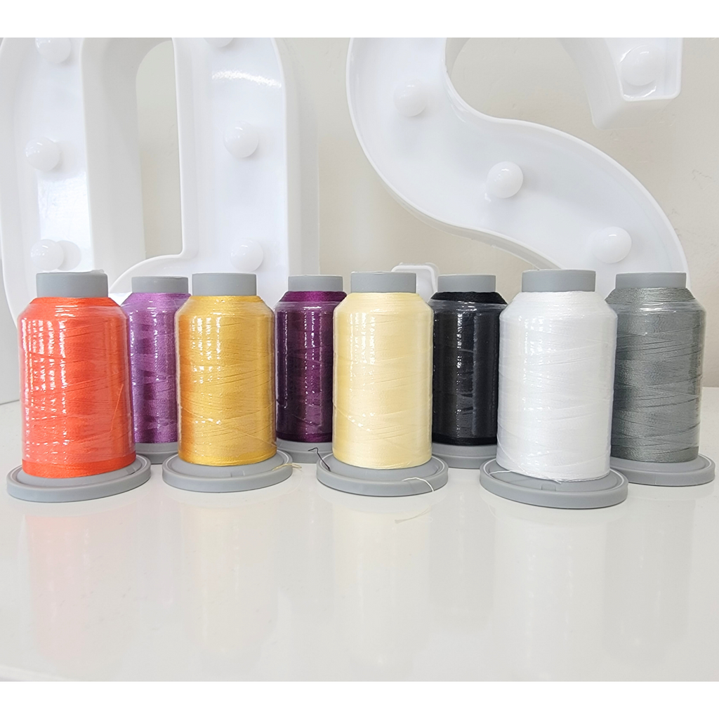 Eight spools of fall-colored Glide thread.