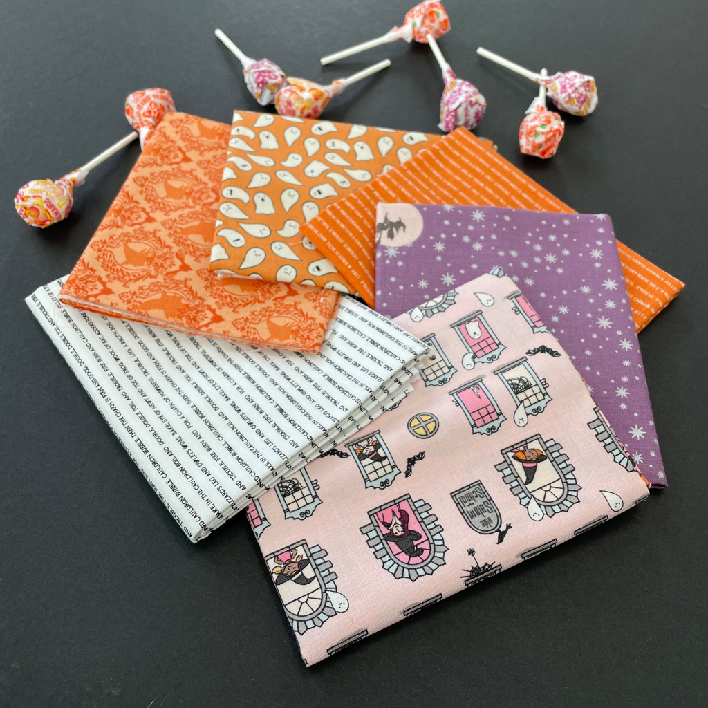 Six fat quarters with Halloween designs on them