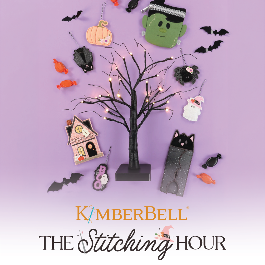 Halloween-themed decorations with a tree, pumpkins, ghosts, and bats on a purple background with Kimberbell branding.