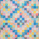 Multicolored patchwork quilt with square patterns