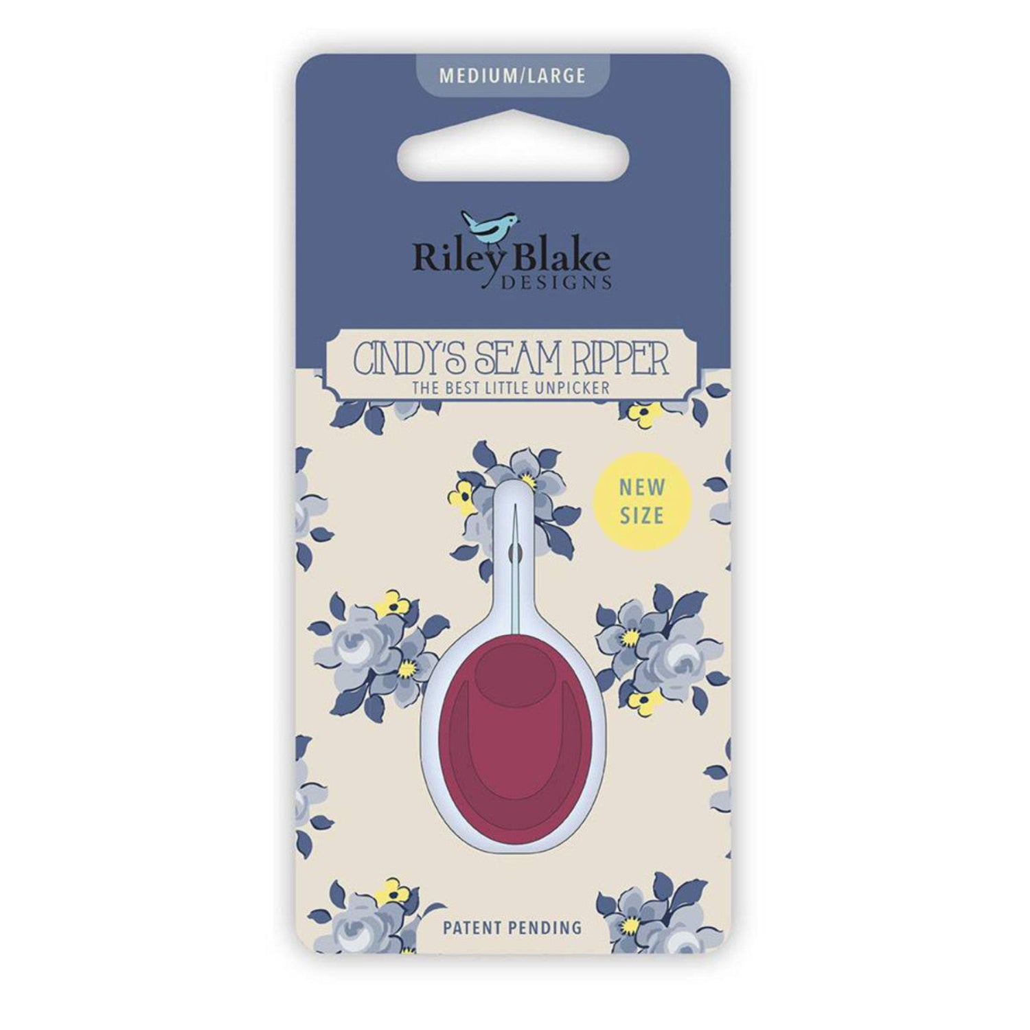 Packaging of Cindy's Seam Ripper by Riley Blake Designs with a medium/large size red seam ripper, displayed on a card with floral patterns.