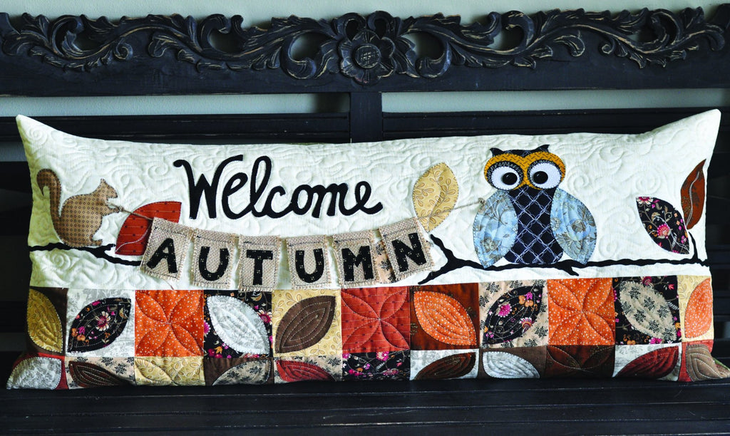 Fall bench pillow with an owl and a squirrel holding up a sign that says welcome autumn