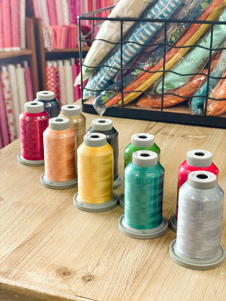 spools of colored thread for quilting